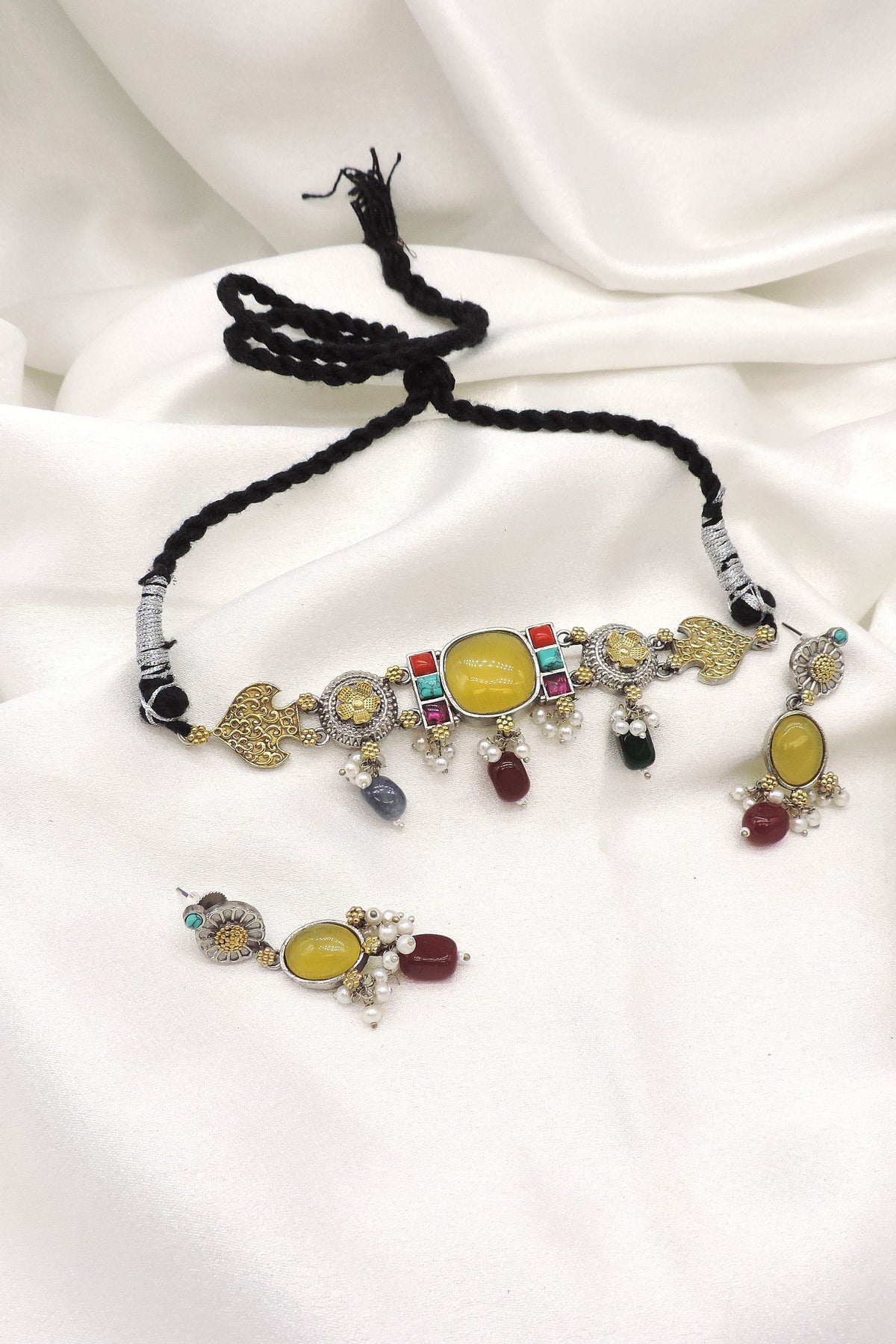 Oxidized dual tone kundan choker set with colorful stones and pearl detailing by joyrias