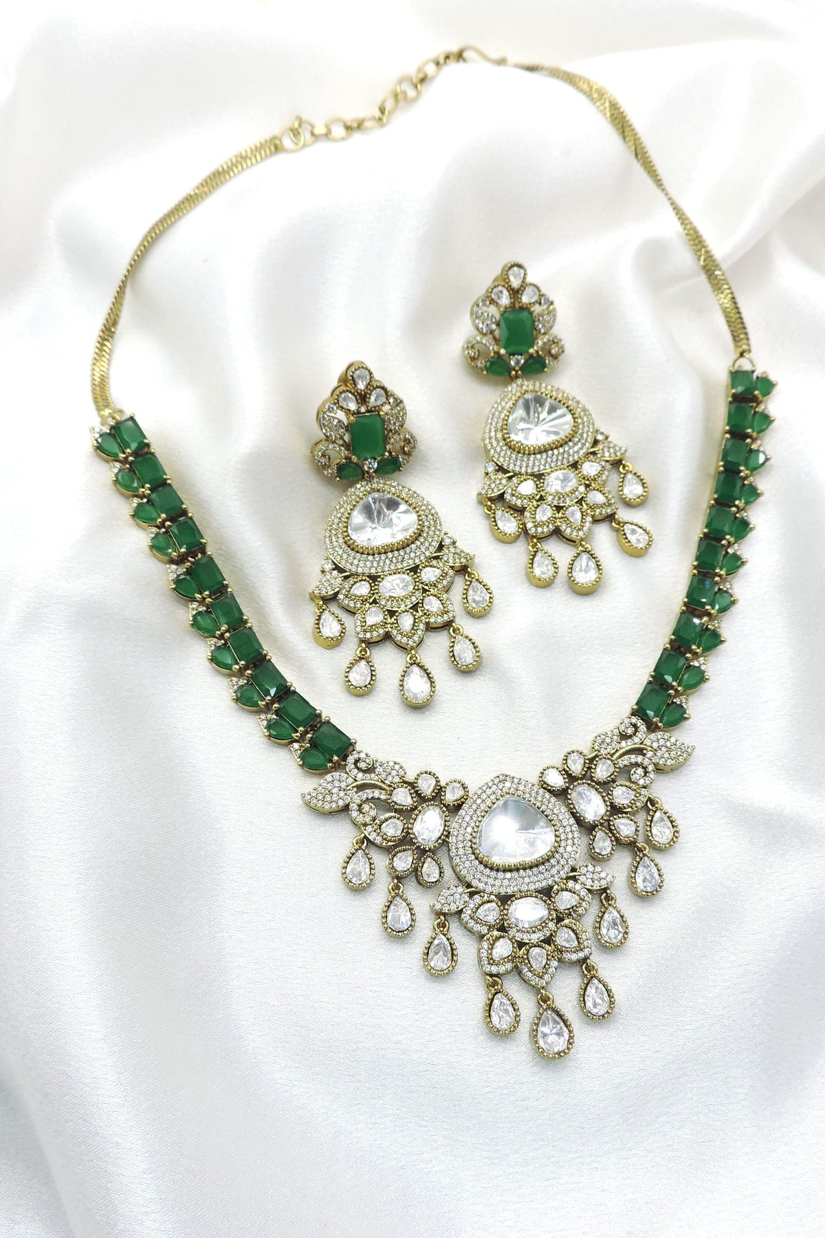 Emerald Kundan  necklace set by Joyrias