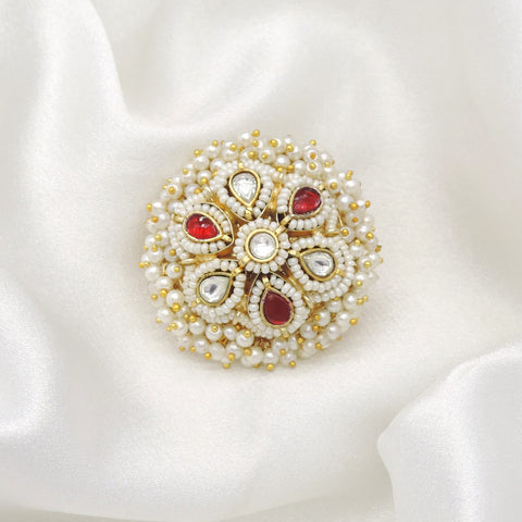 Gold-toned pearl kundan floral ring with red accents by joyrias