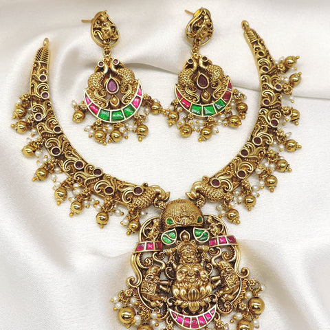 Temple gold-toned Lakshmi peacock multicolor necklace set with matching earrings and pearl detailing by joyrias