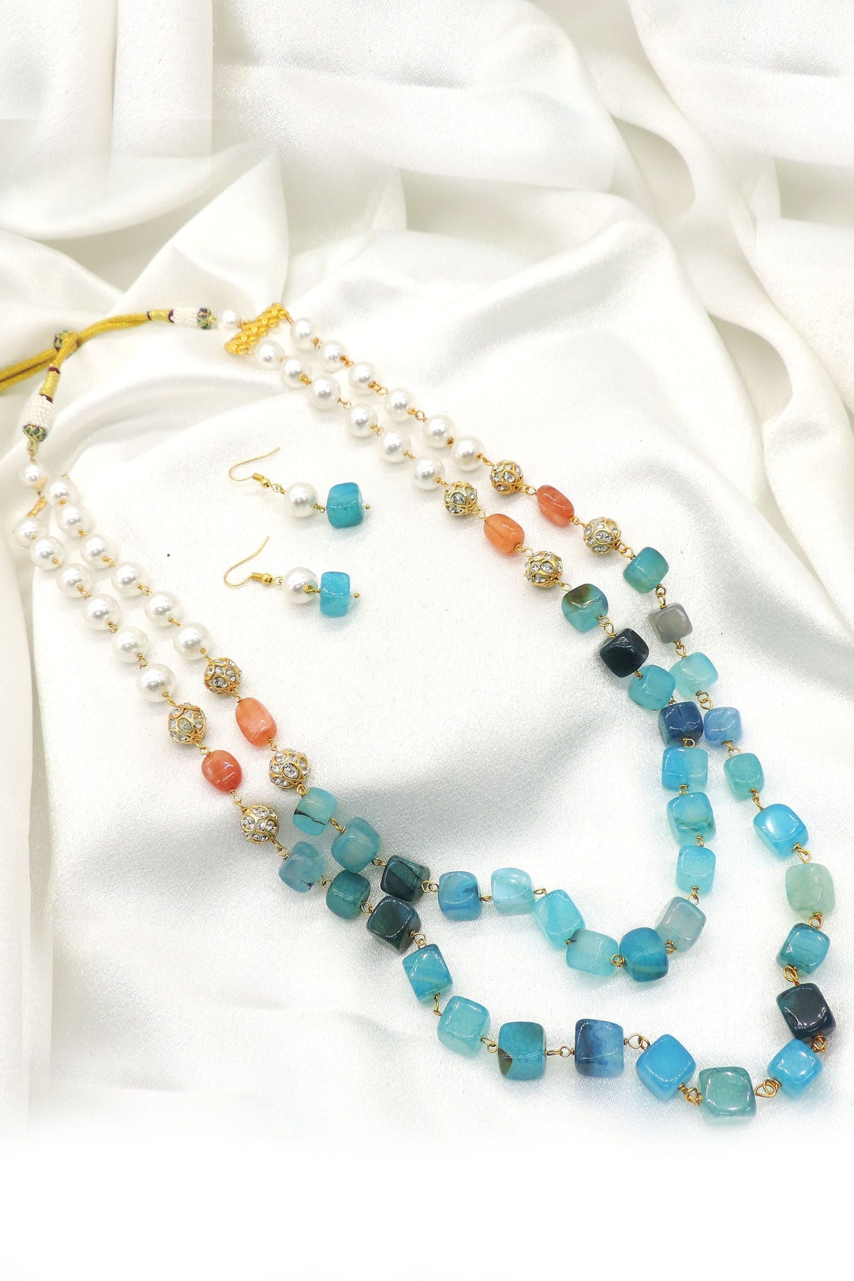 Ocean blue layered pearl necklace set with matching earrings and coastal-inspired bead accents