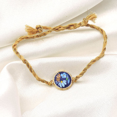 Blue Floral Bhaiya Rakhi by Joyrias