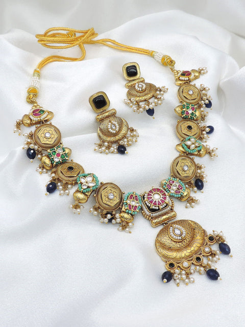Royal gold-toned multicolor kundan necklace set with pearl detailing by joyrias