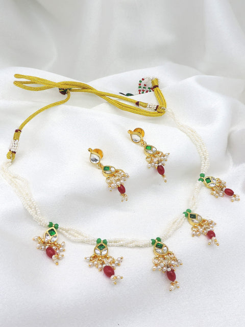 Gold-toned multicolor pearl kundan necklace set with matching earrings by joyrias