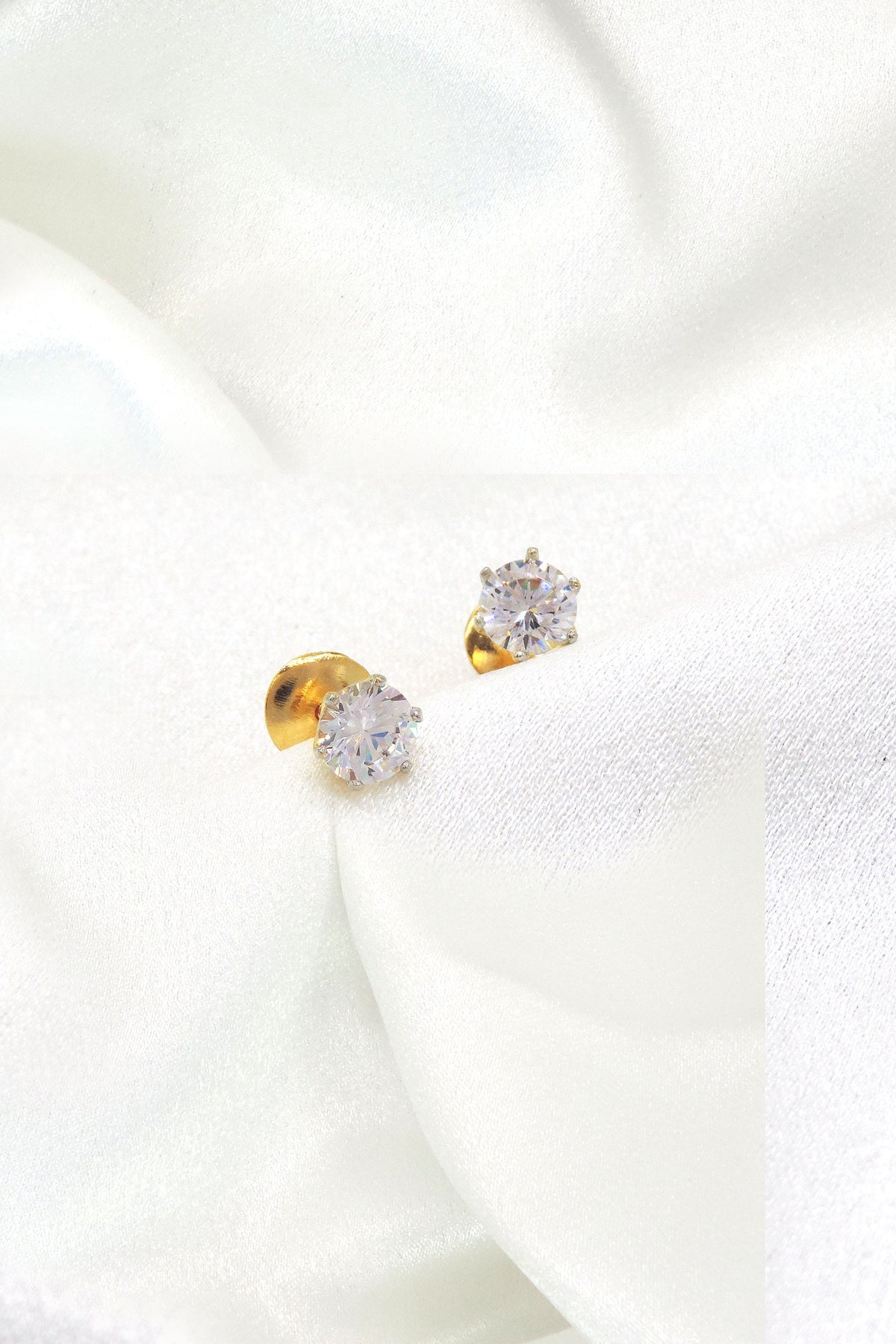 Classic solitaire CZ stud earrings in gold-tone setting