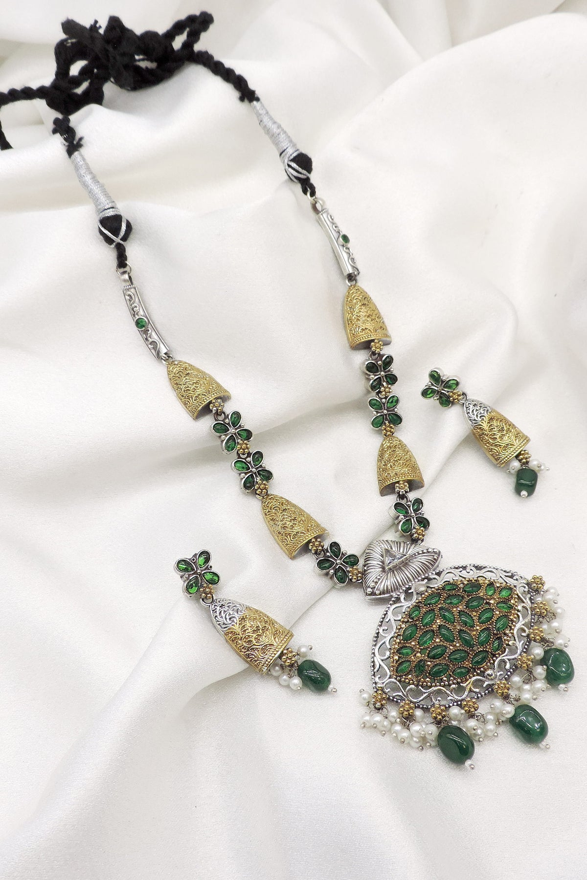Oxidized dual-tone green floral pendant necklace set with matching earrings and pearl detailing by joyrias