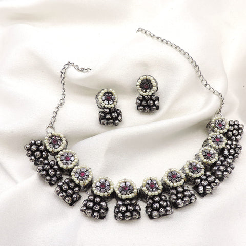 Oxidized black pearl floral choker set with matching earrings by joyrias