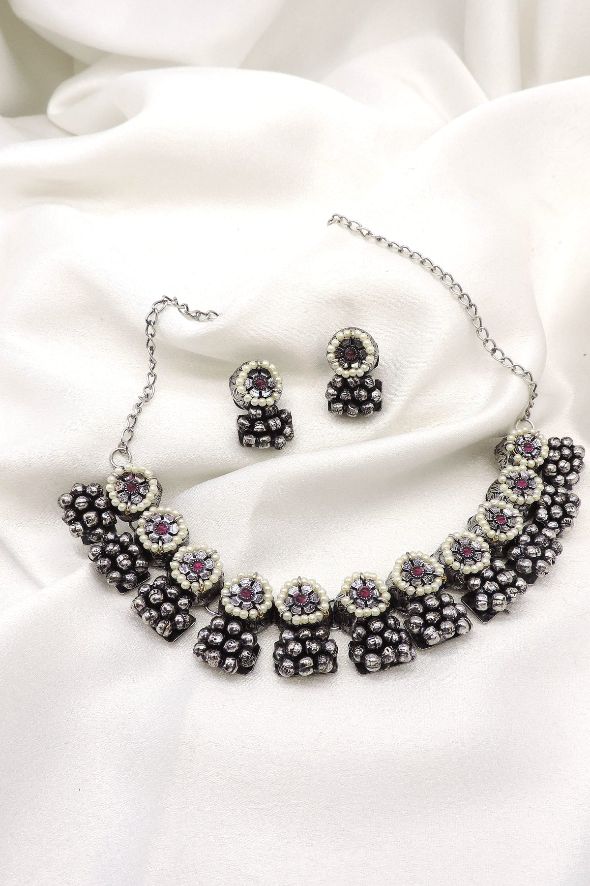 Oxidized black pearl floral choker set with matching earrings by joyrias