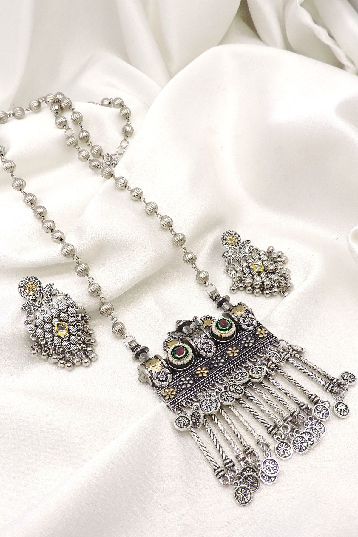 Oxidized silver floral pendant long necklace set with colorful stones and matching earrings by joyrias