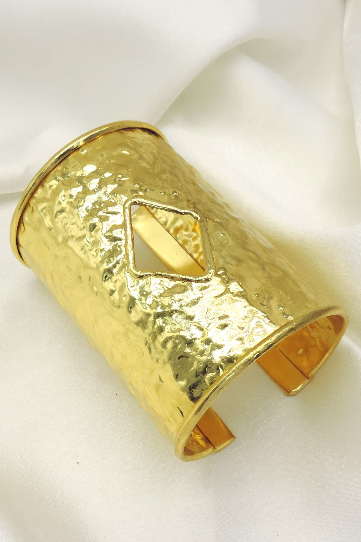 Hammered gold cuff bracelet by Joyrias