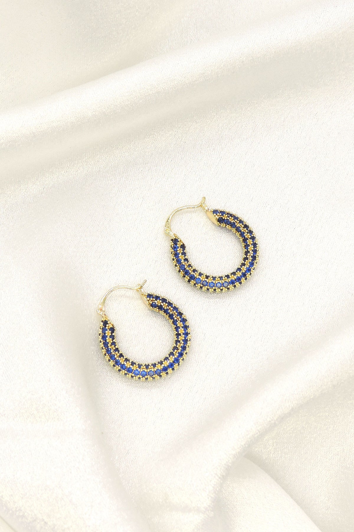 Elegant blue accent stone imitation hoop earrings with gold finish