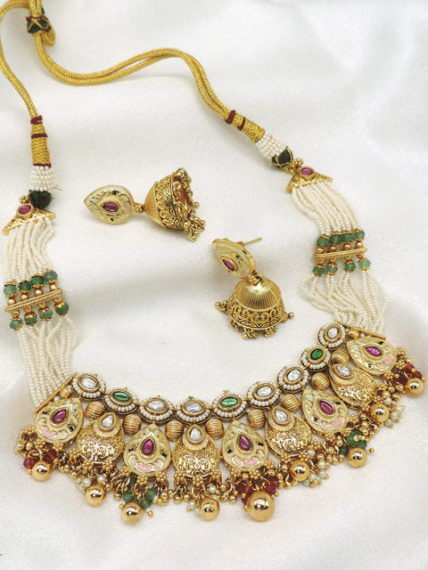 Rajwadi kundan meenakari choker necklace set with green and maroon detailing, pearl strands and matching jhumka earrings by joyrias
