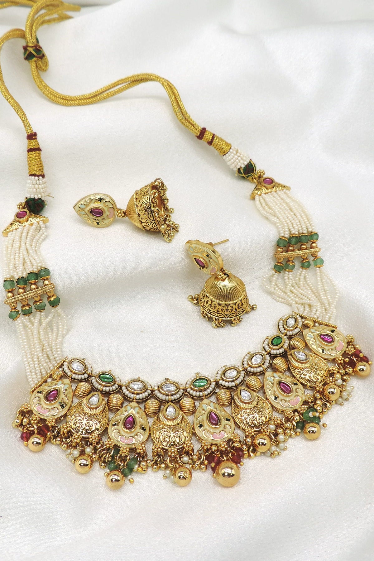 Rajwadi kundan meenakari choker necklace set with green and maroon detailing, pearl strands and matching jhumka earrings by joyrias