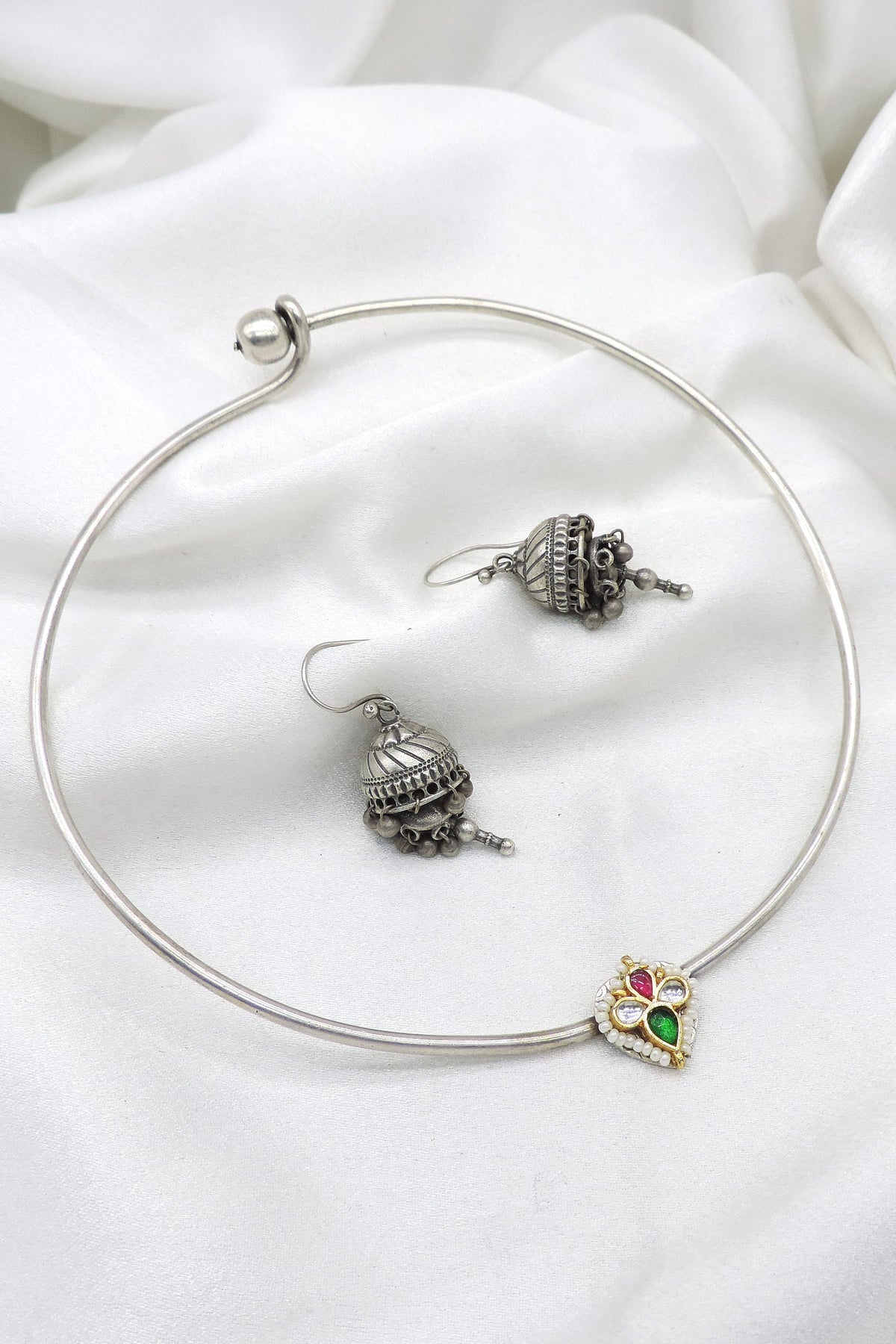 Oxidized silver Hasli heart pendant choker set with matching jhumka earrings by joyrias