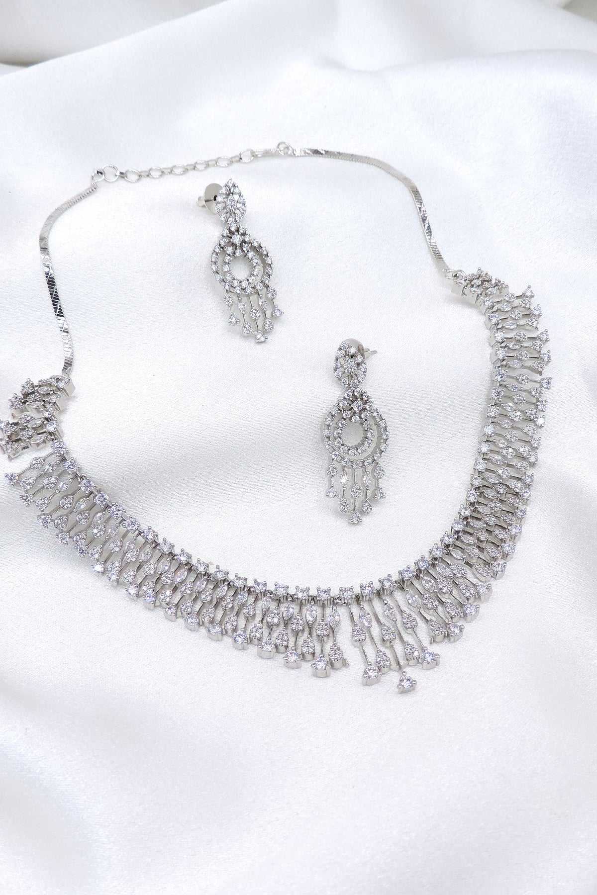 Silver CZ layered necklace set with matching dangling earrings by joyrias