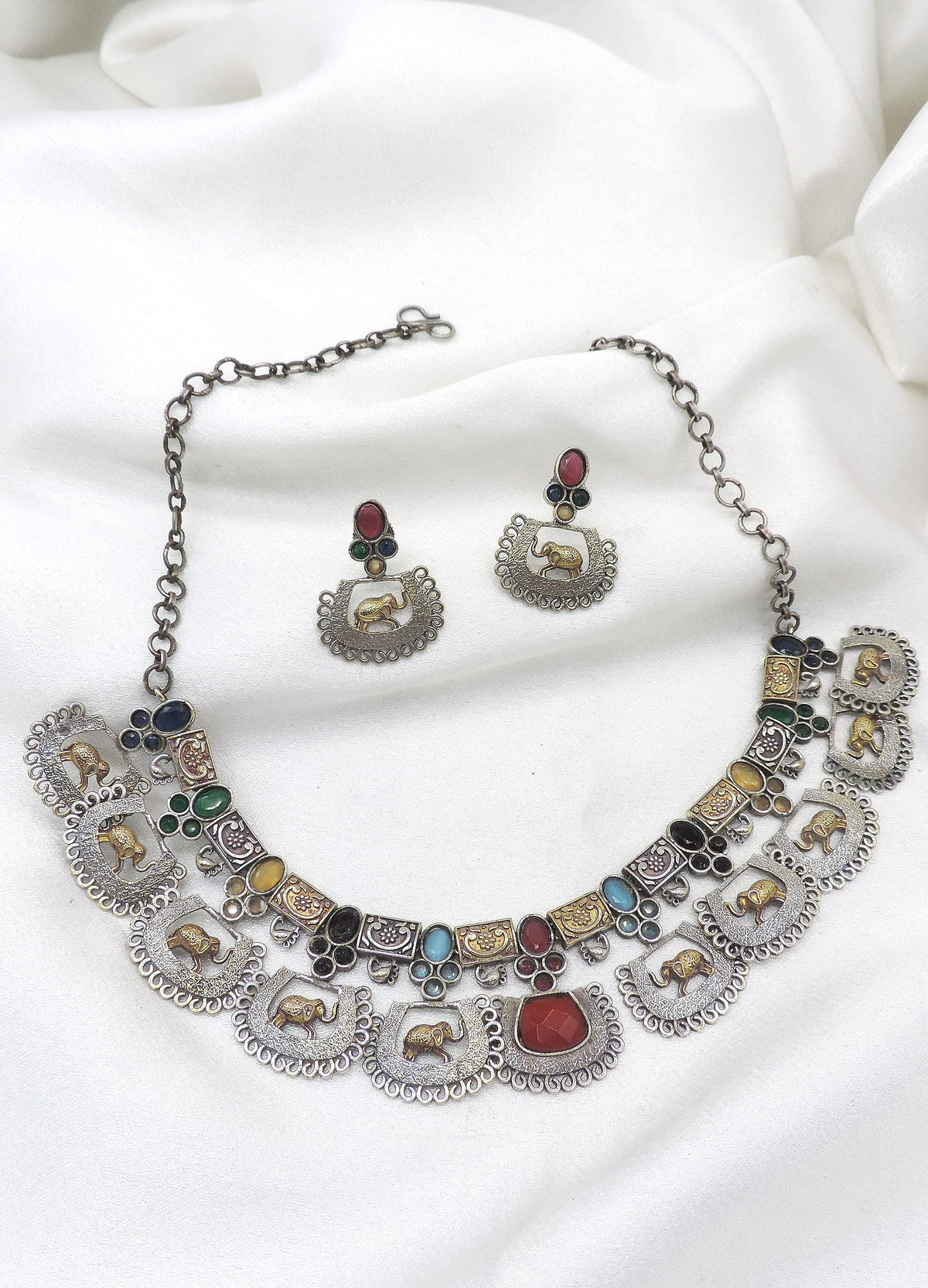 Oxidized dual-tone elephant multicolor choker set with colorful stones and matching earrings by joyrias
