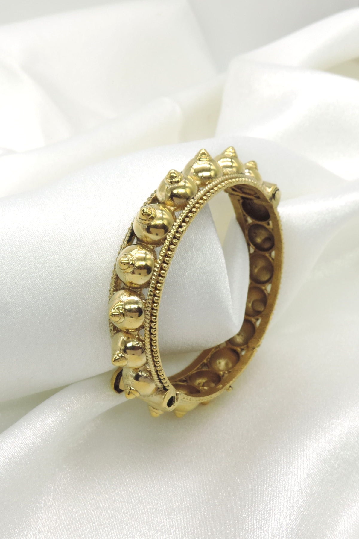 Antique Gold Studded Flexi Bangle by Joyrias