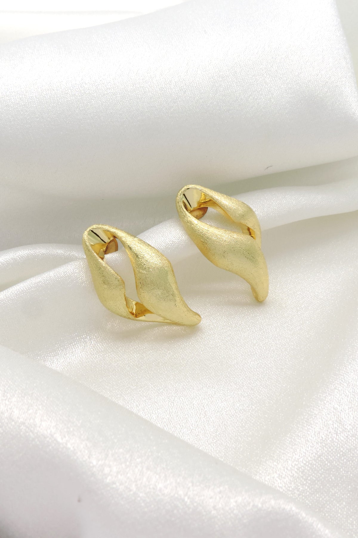 Matte Gold Twist Hoop Earrings by Joyrias