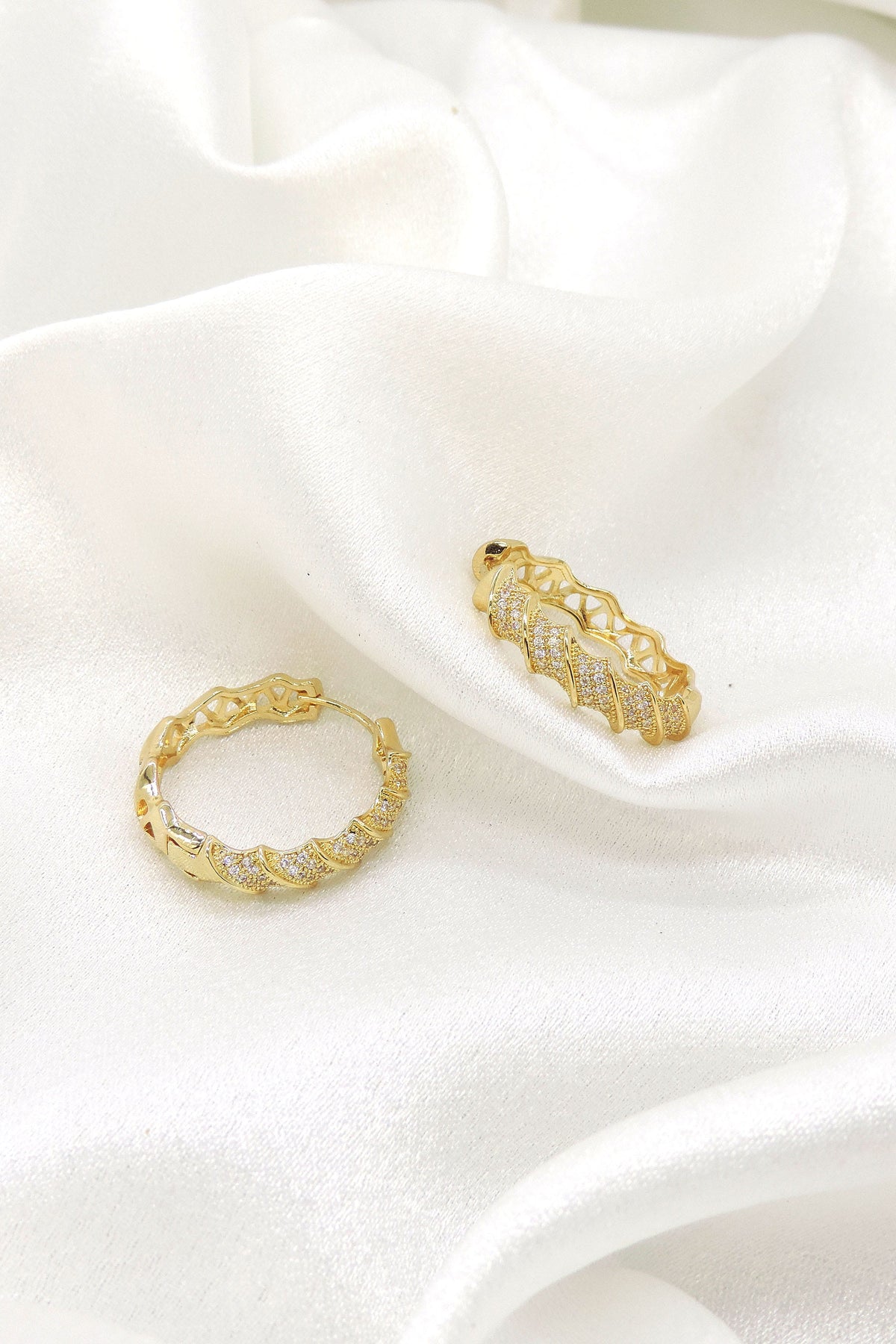 Luxe gold CZ hoop earrings with sculpted twist detailing