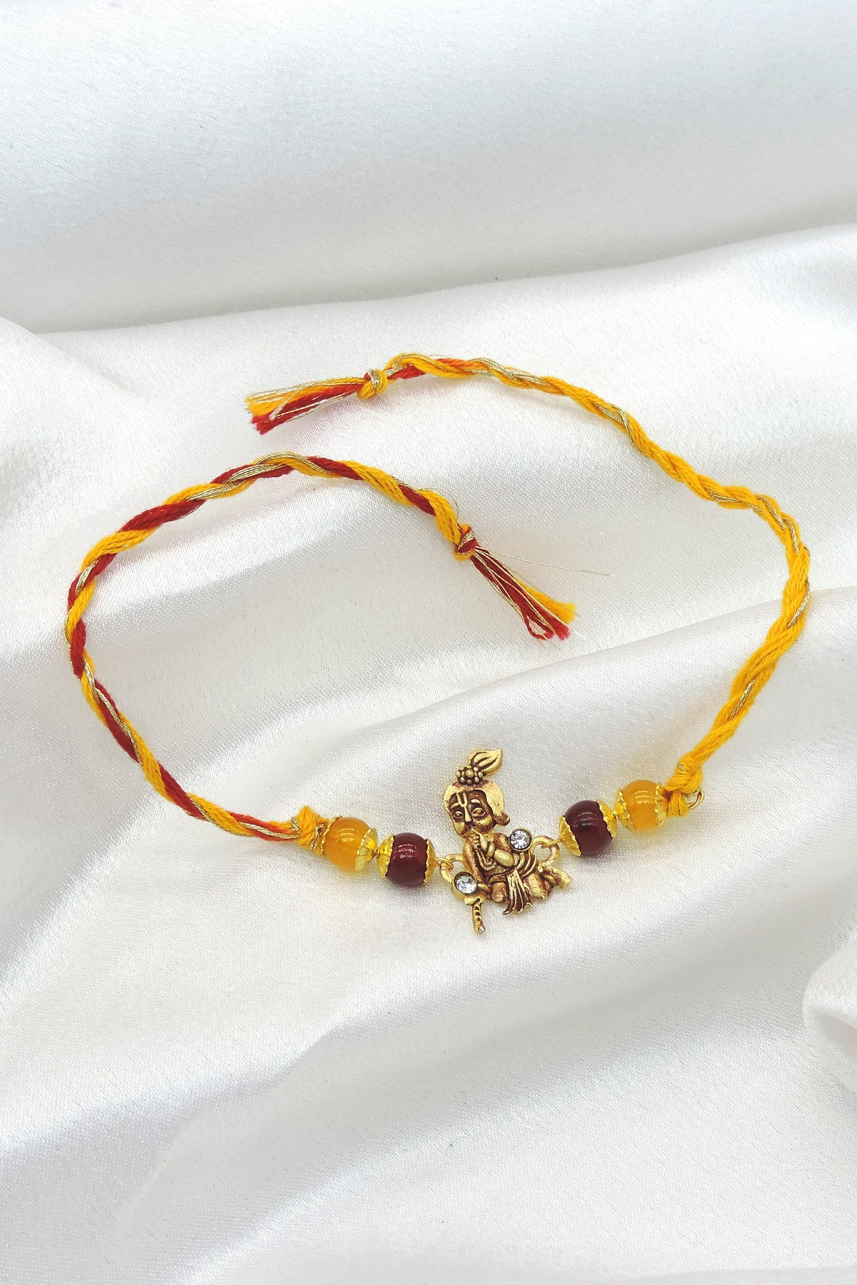 Krishna charm beaded rakhi by Joyrias