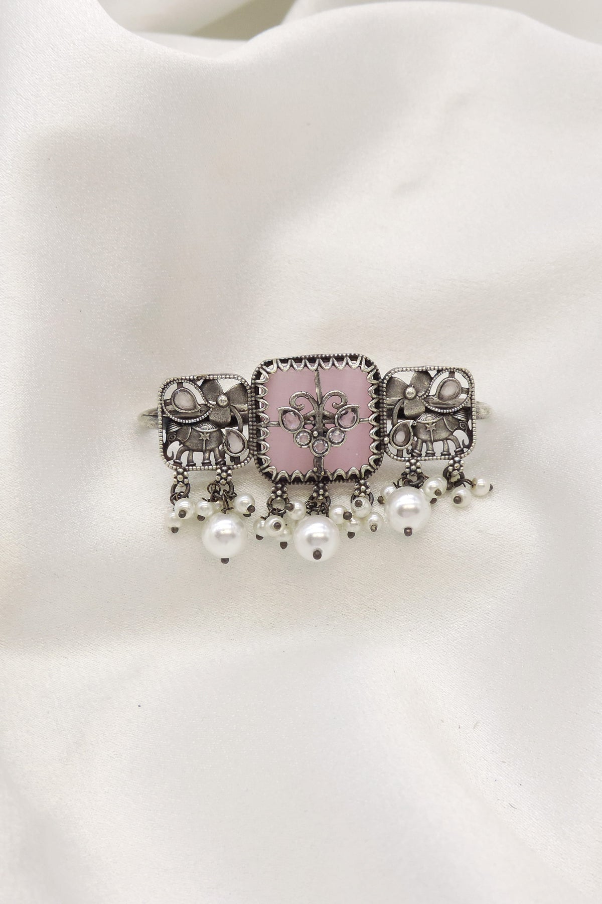 Oxidised elephant motif ring with pearl accents and traditional detailing from joyrias