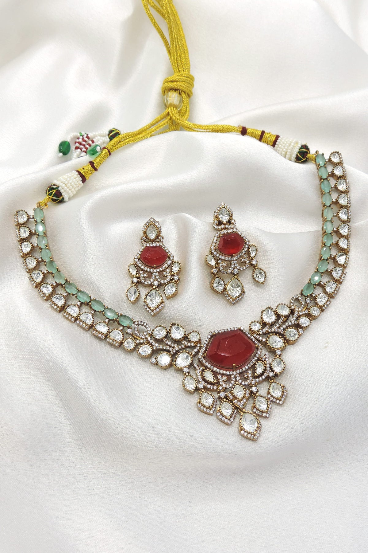 Ruby and mint Kundan necklace set by Joyrias