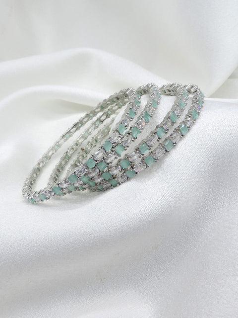 Exquisite silver-toned aqua stone AD bangle set with sparkling detailing by joyrias