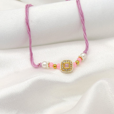 Pink square CZ pearl bhaiya rakhi by Joyrias