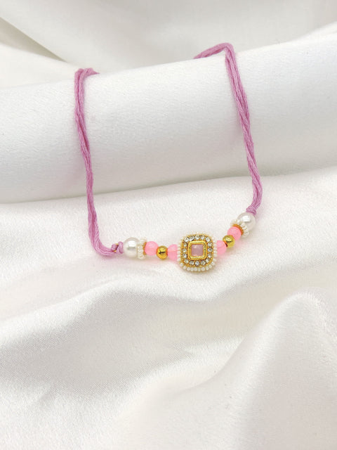 Pink square CZ pearl bhaiya rakhi by Joyrias