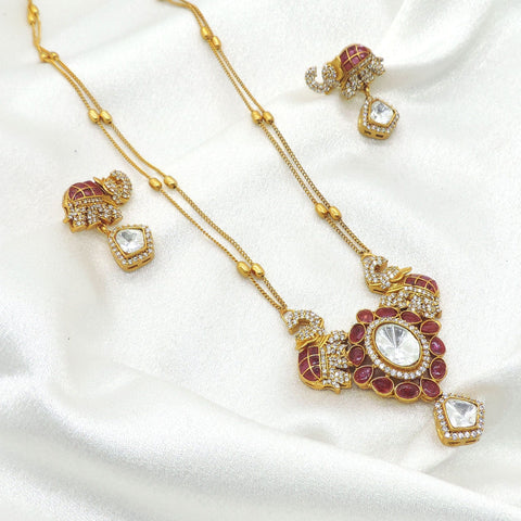 Majestic elephant motif necklace set with red and clear stones and matching earrings