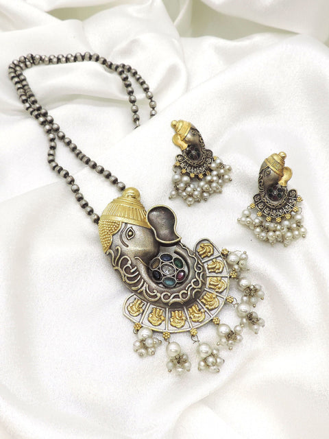 Ganesha motif imitation necklace set with accent stones, pearl clusters, CZ accents, and matching earrings