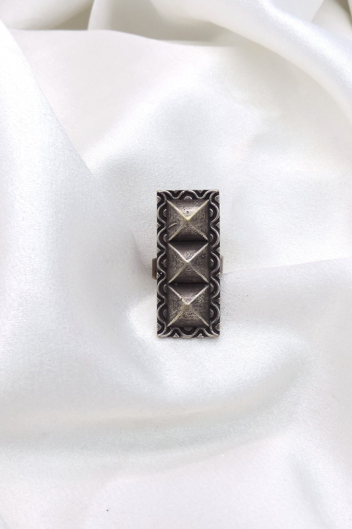 Oxidized silver geometric pyramid ring with traditional detailing by joyrias