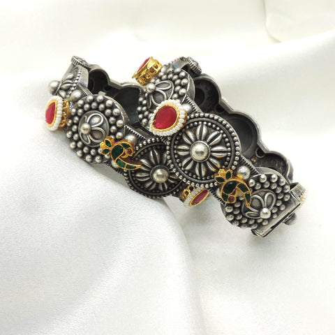Oxidized peacock floral bangle by Joyrias