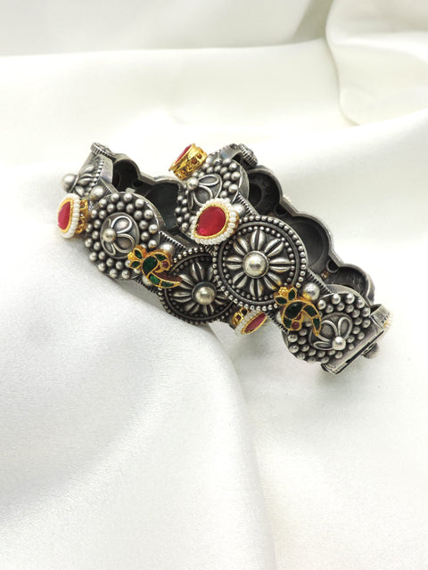 Oxidized peacock floral bangle by Joyrias