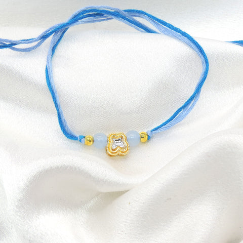 Clover charm blue bead bhaiya rakhi by Joyrias