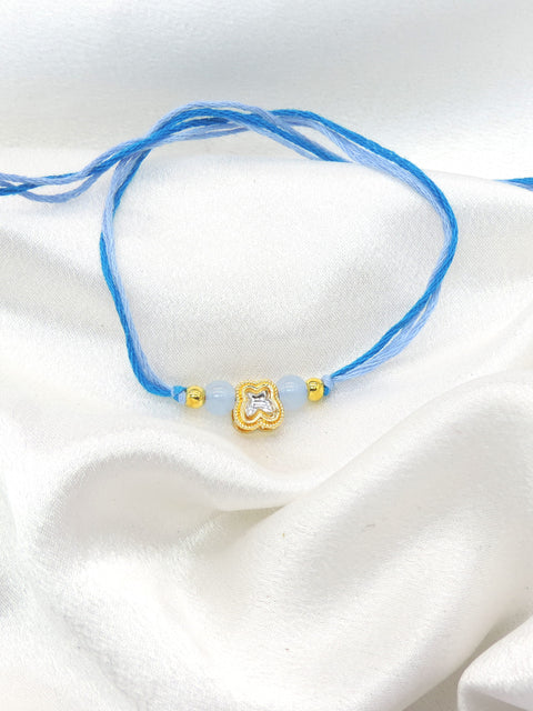 Clover charm blue bead bhaiya rakhi by Joyrias