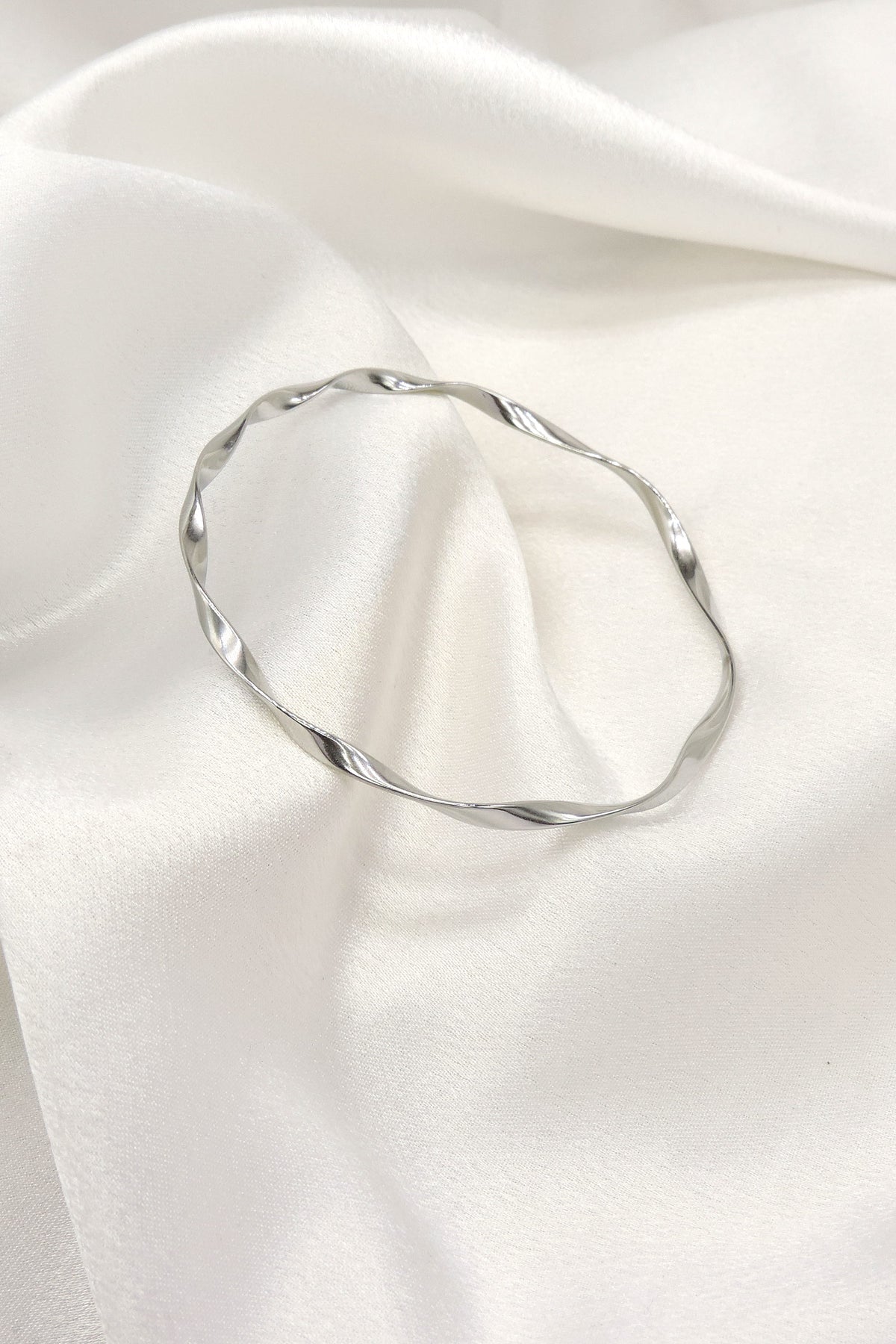 Twisted Silver Bangle Bracelet by Joyrias