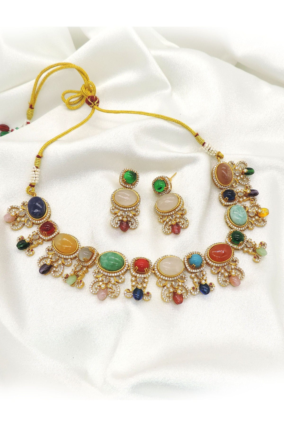 Regal pearl circular pendant imitation choker set with faux pearls, red and white accent stones, CZ accents, and matching earrings