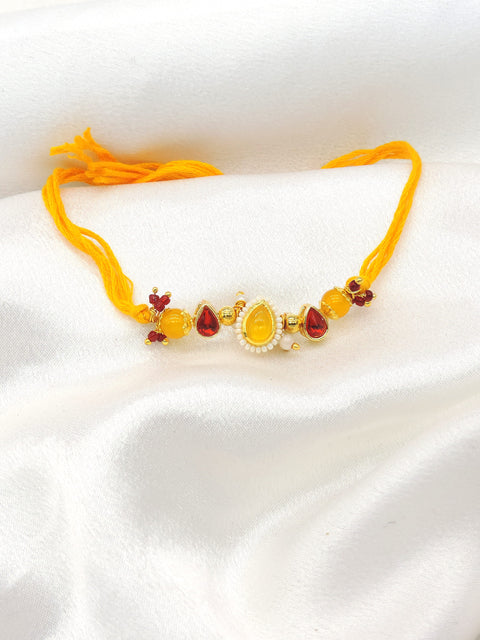 Amber teardrop pearl bhaiya rakhi by Joyrias