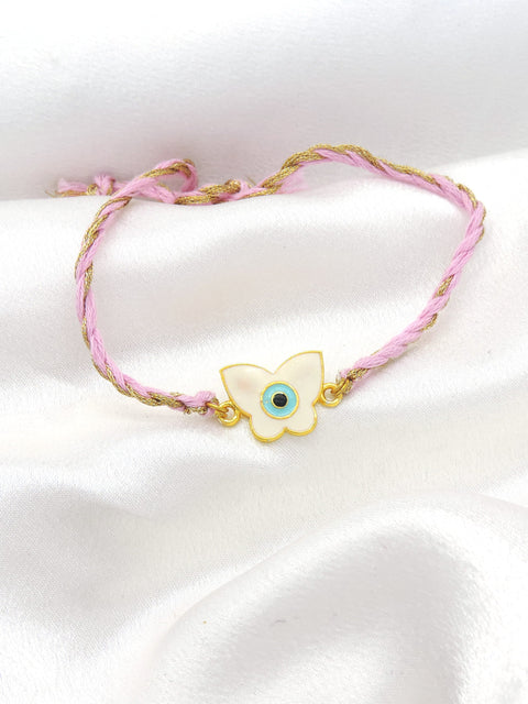 Butterfly evil eye bhaiya rakhi with white enamel charm on braided pink gold thread by Joyrias