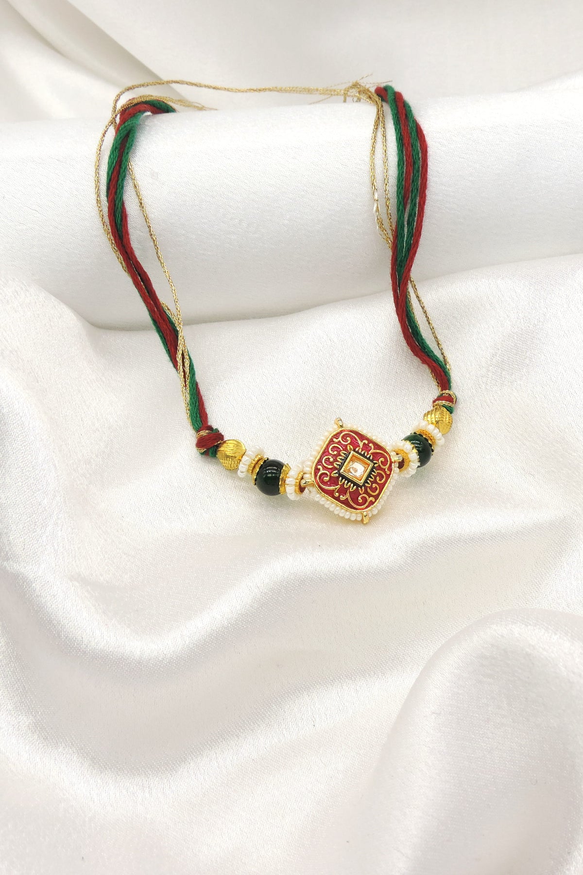 Red Meenakari Bhaiya Rakhi by Joyrias
