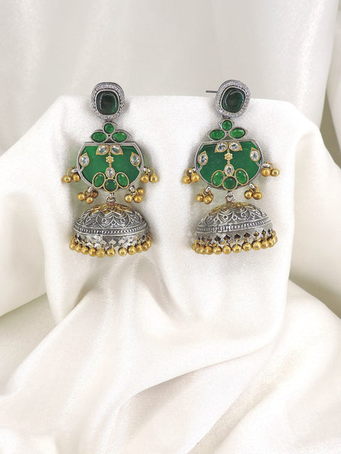 Oxidized dual-tone green stone jhumka earrings with gold-toned bead detailing by joyrias