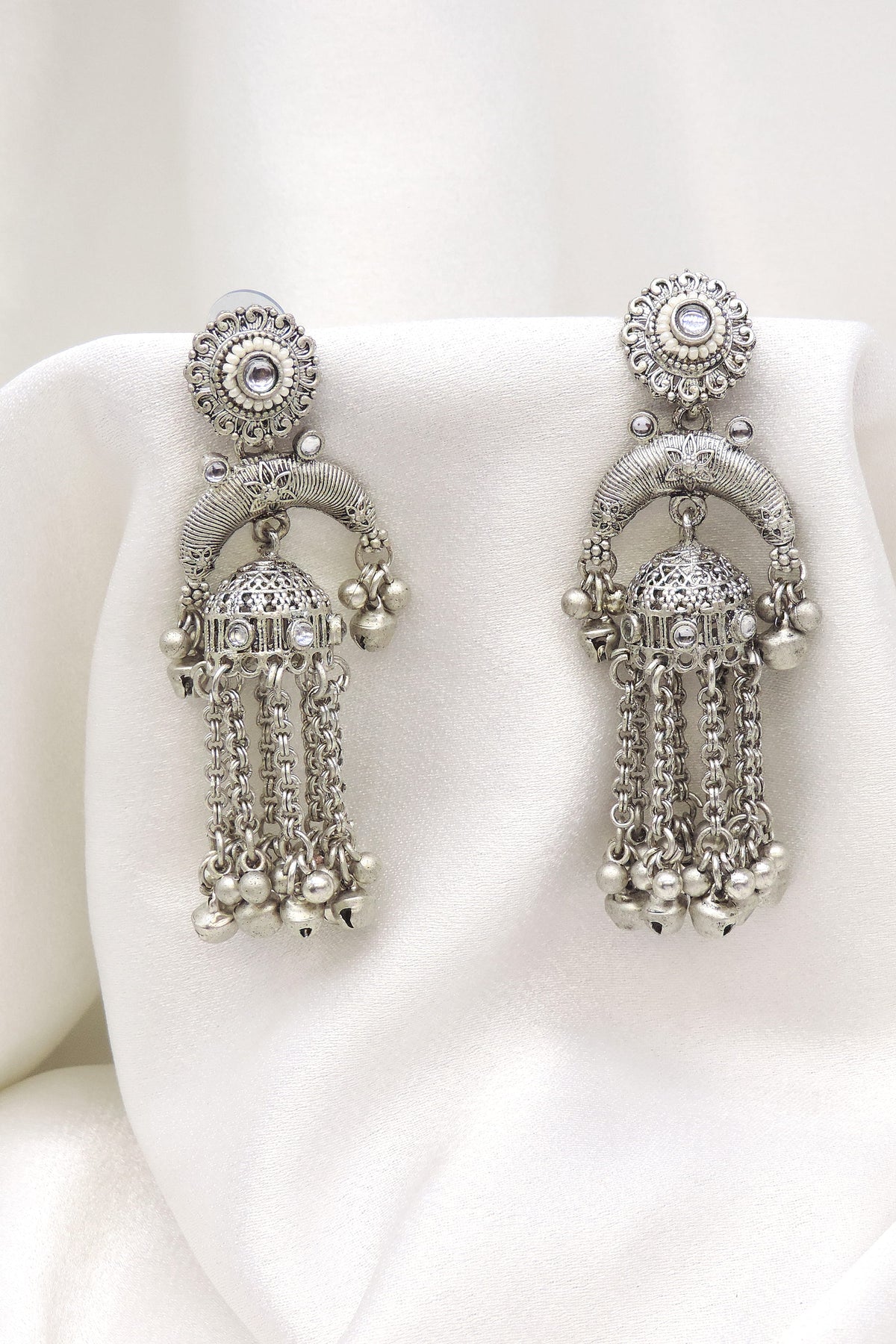 Oxidized silver arched long chain jhumka earrings with traditional silver bead detailing by joyrias