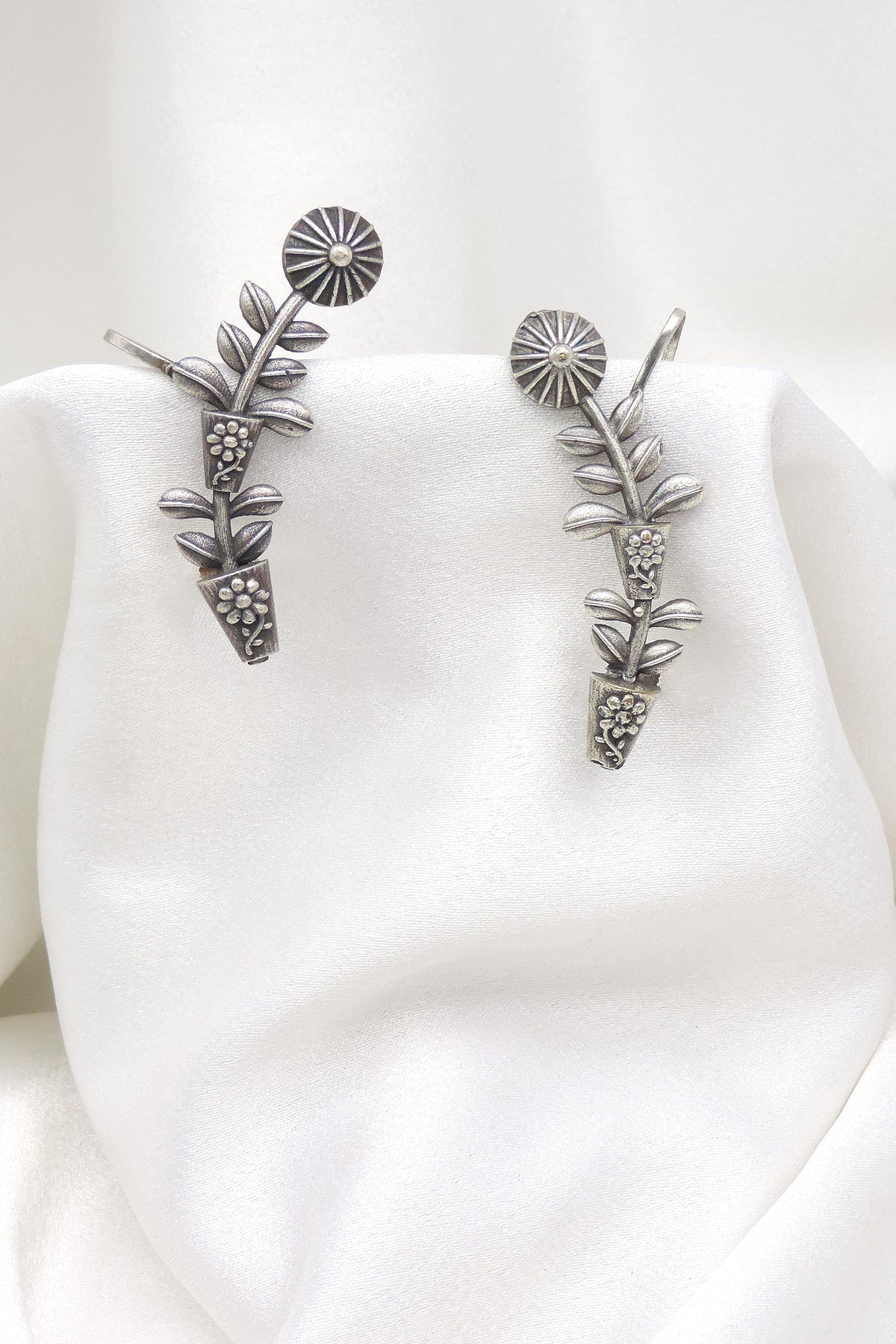 Oxidized silver floral leaf ear cuff earrings with intricate botanical detailing by joyrias