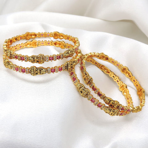 Pink gold bangle set with traditional detailing by Joyrias