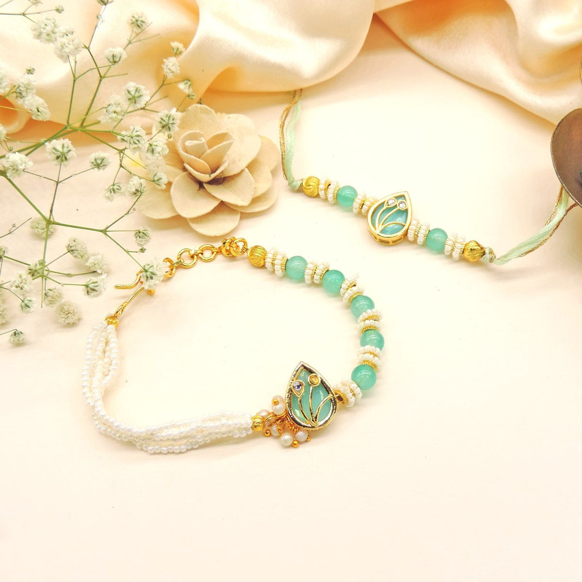 Mint Lotus Bhaiya Bhabhi Rakhi Set by Joyrias
