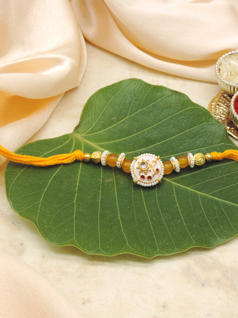 Floral Designer Rakhi with Yellow Beads