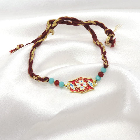 Meenakari floral rectangle bhaiya rakhi with white floral motif and turquoise beads on maroon gold thread by Joyrias