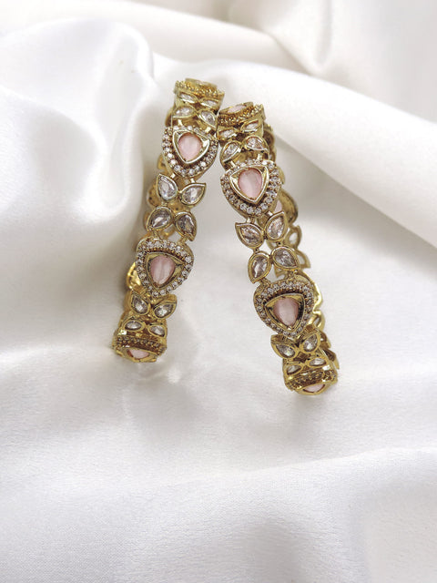 Pink stone designer bangle set with gold-tone detailing by Joyrias