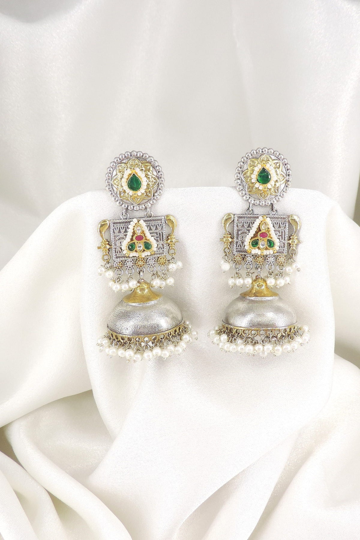 Dual-tone green red temple jhumka earrings with pearl detailing by joyrias